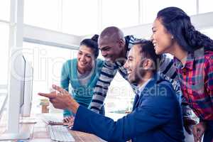 Cheerful businessman giving training to team