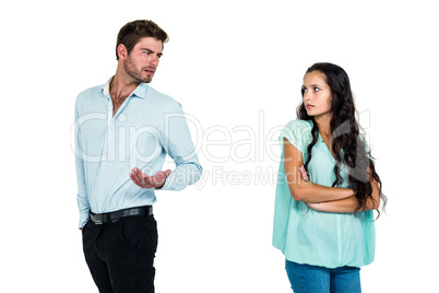 Couple standing back to back while arguing