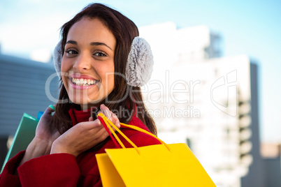 Smiling women holding shopping bags