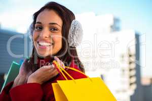 Smiling women holding shopping bags