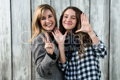 Mother and daughter doing signs