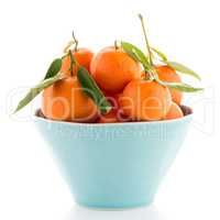 Tangerines on ceramic blue bowl