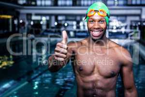 Fit swimmer standing with thumbs up