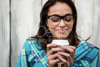 Girl smelling her coffee