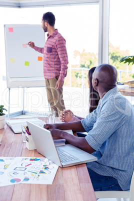 Young businessman giving presentation