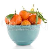 Tangerines on ceramic blue bowl