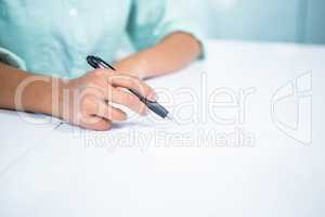 Close up view of a businesswoman writing notes