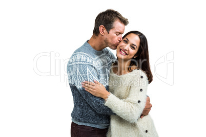 Boyfriend kissing girlfriend while standing