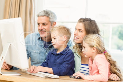 Happy family using the computer