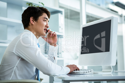 Asian businessman talking on the telephone