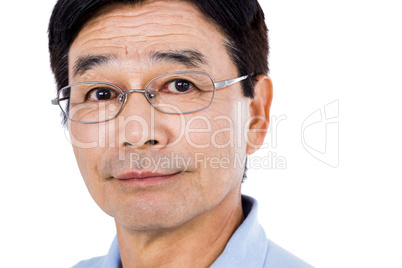 Close-up portrait of confident man wearing eyeglasses