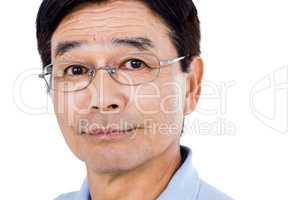 Close-up portrait of confident man wearing eyeglasses