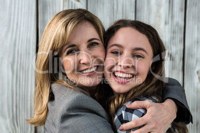 Mother and daughter hugging