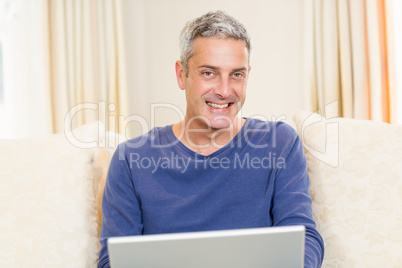 Handsome man using laptop Handsome man using laptop