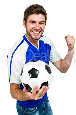 Portrait of smiling man holding football