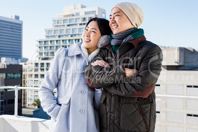 Smiling couple looking away