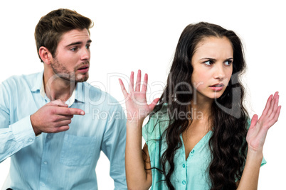 Couple sitting on chairs having argument