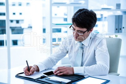 Focused asian businessman is working