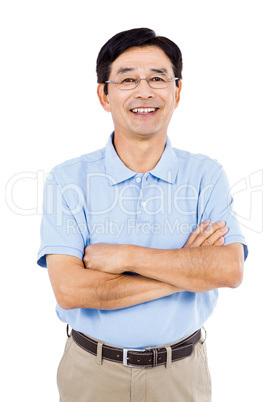 Portrait of happy man with arms crossed