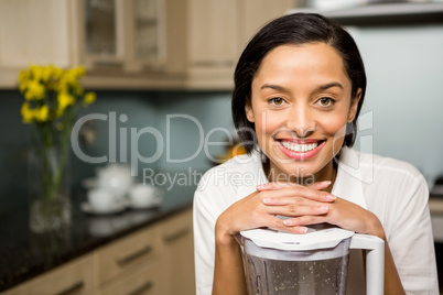 Portrait of smiling brunette in kitchen