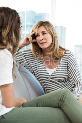 Mother talking to daughter