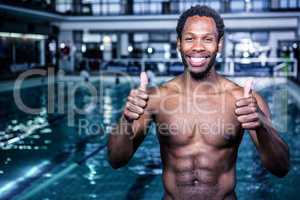 Fit swimmer standing with thumbs up