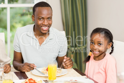 Happy family enjoying their meal