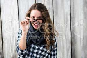 Girl putting her glasses off