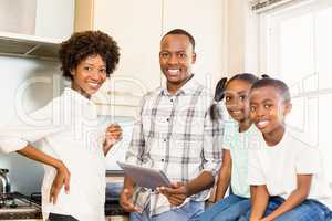 Happy family looking at tablet