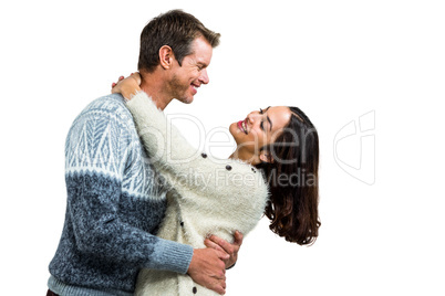Romantic couple embracing in warm clothing