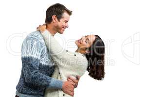 Romantic couple embracing in warm clothing