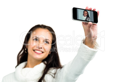 Smiling woman taking selfie