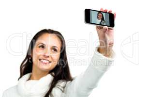 Smiling woman taking selfie