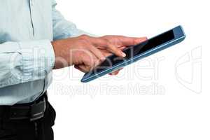Midsection of man using digital tablet
