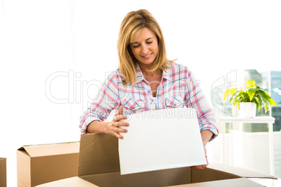 Woman opening a box