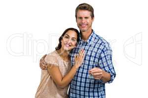Portrait of cheerful couple holding home keys