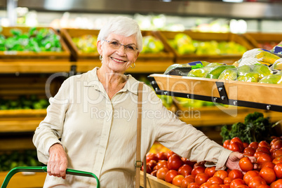 Senior woman picking out some vegetables