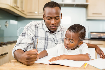 Father helping son for homework