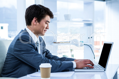 Asian businessman using his computer