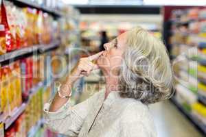 Senior woman choosing food