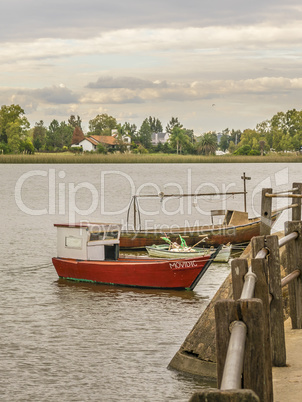 Small fishing boats anchored in the waters of Santa Lucia river
