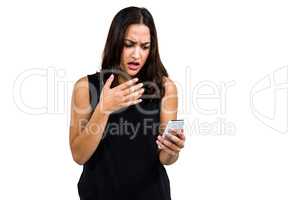 Shocked woman using phone