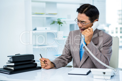 Worried businessman in the phone