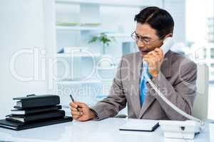 Worried businessman in the phone