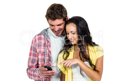 Smiling couple using smartphone