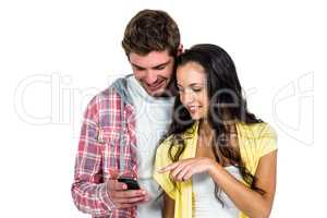 Smiling couple using smartphone