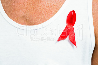 Close-up of aids ribbon on vest