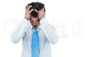 Irritated asian businessman holding his head