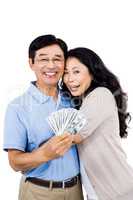 Smiling couple with cash in hand