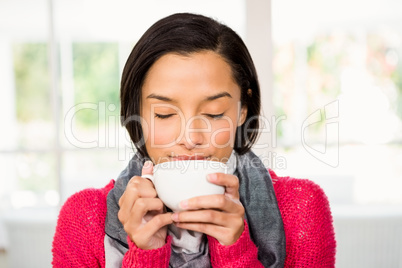 Smiling brunette holding mug